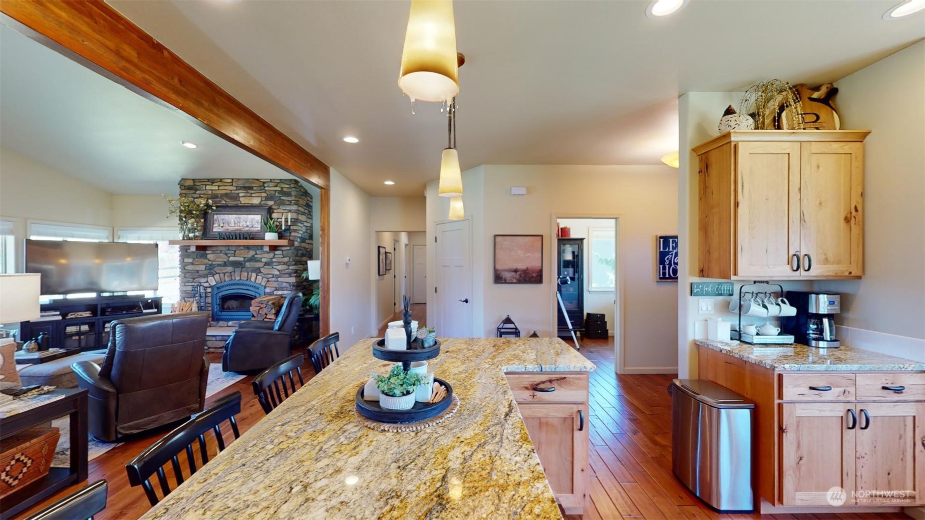 192 Hubbard Road Riverside, WA 98849 - Photo 13 of 40 a kitchen with stainless steel appliances kitchen island granite countertop a table chairs in it and wooden floors