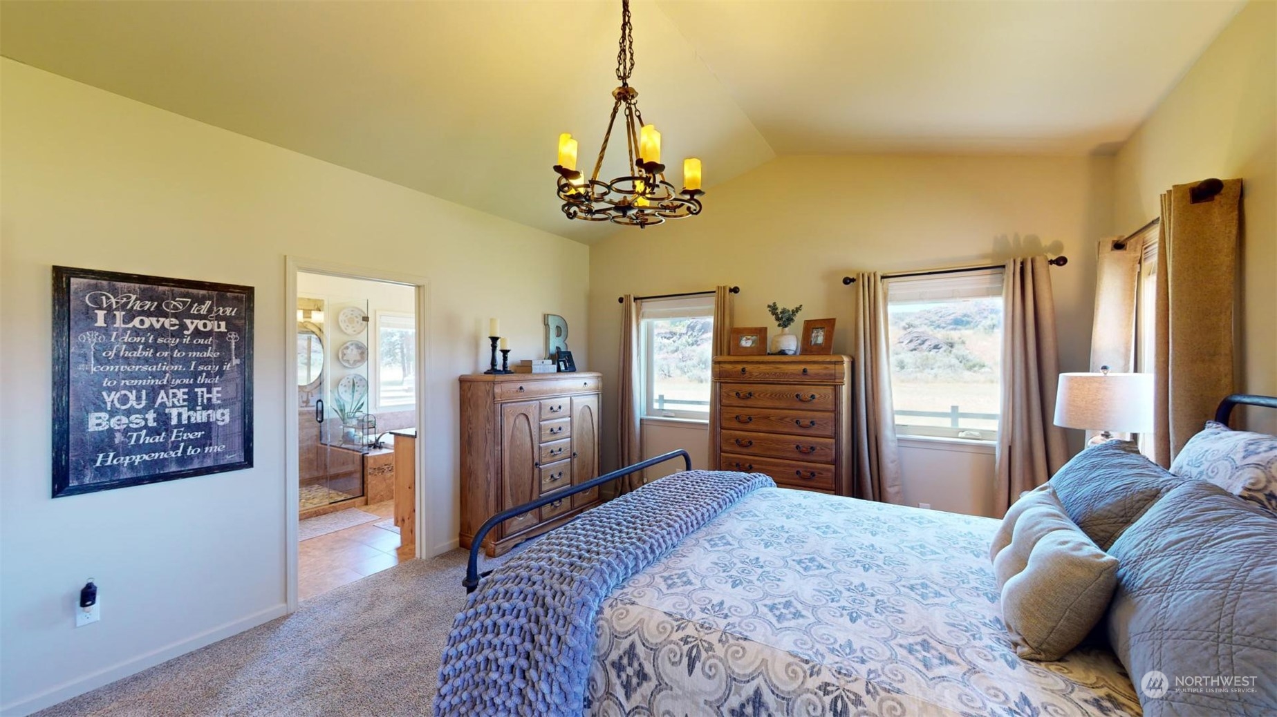 192 Hubbard Road Riverside, WA 98849 - Photo 16 of 40 a bedroom with a bed dresser and wooden floor