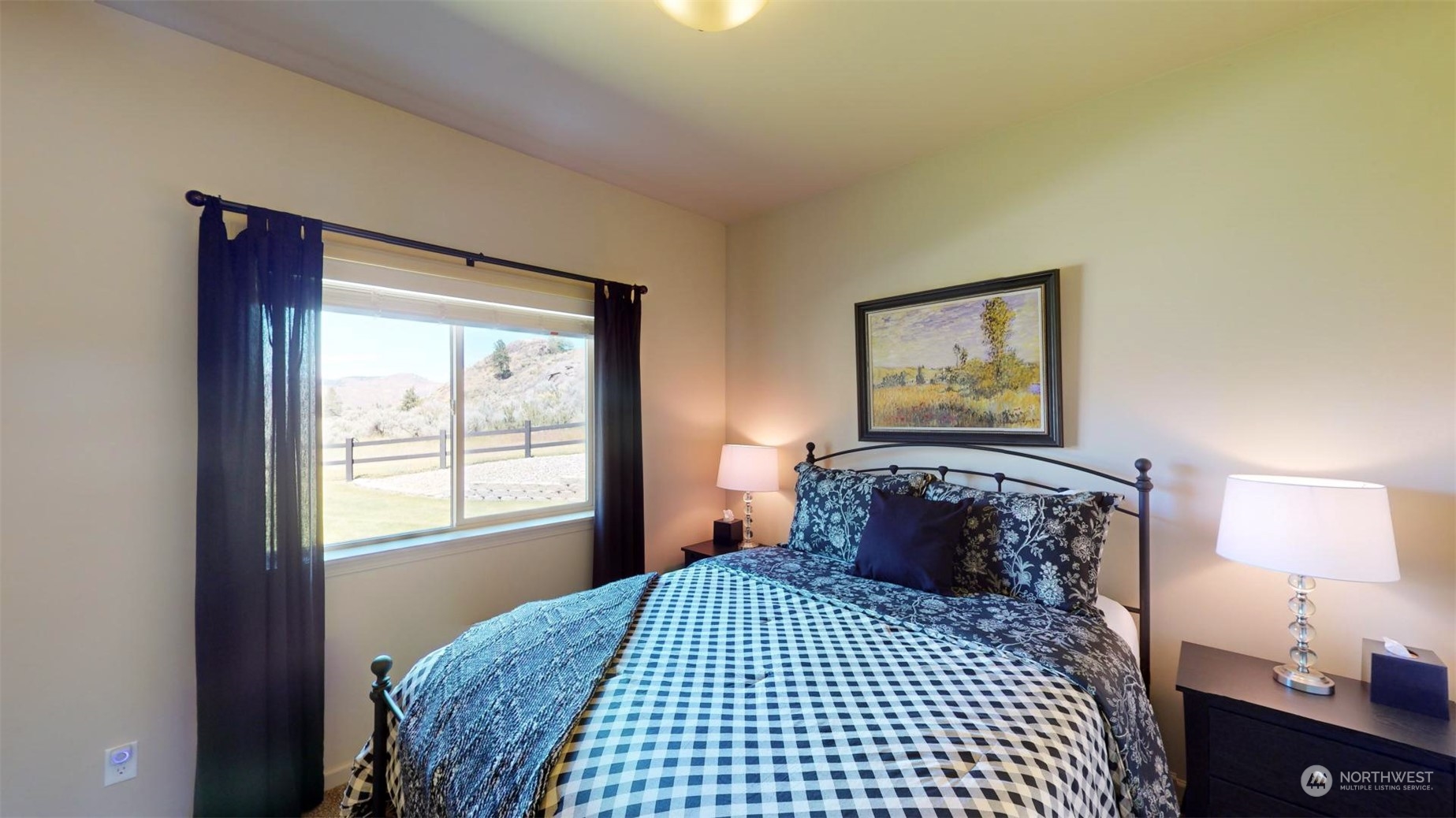 192 Hubbard Road Riverside, WA 98849 - Photo 20 of 40 a bedroom with a bed and a lamp on dresser