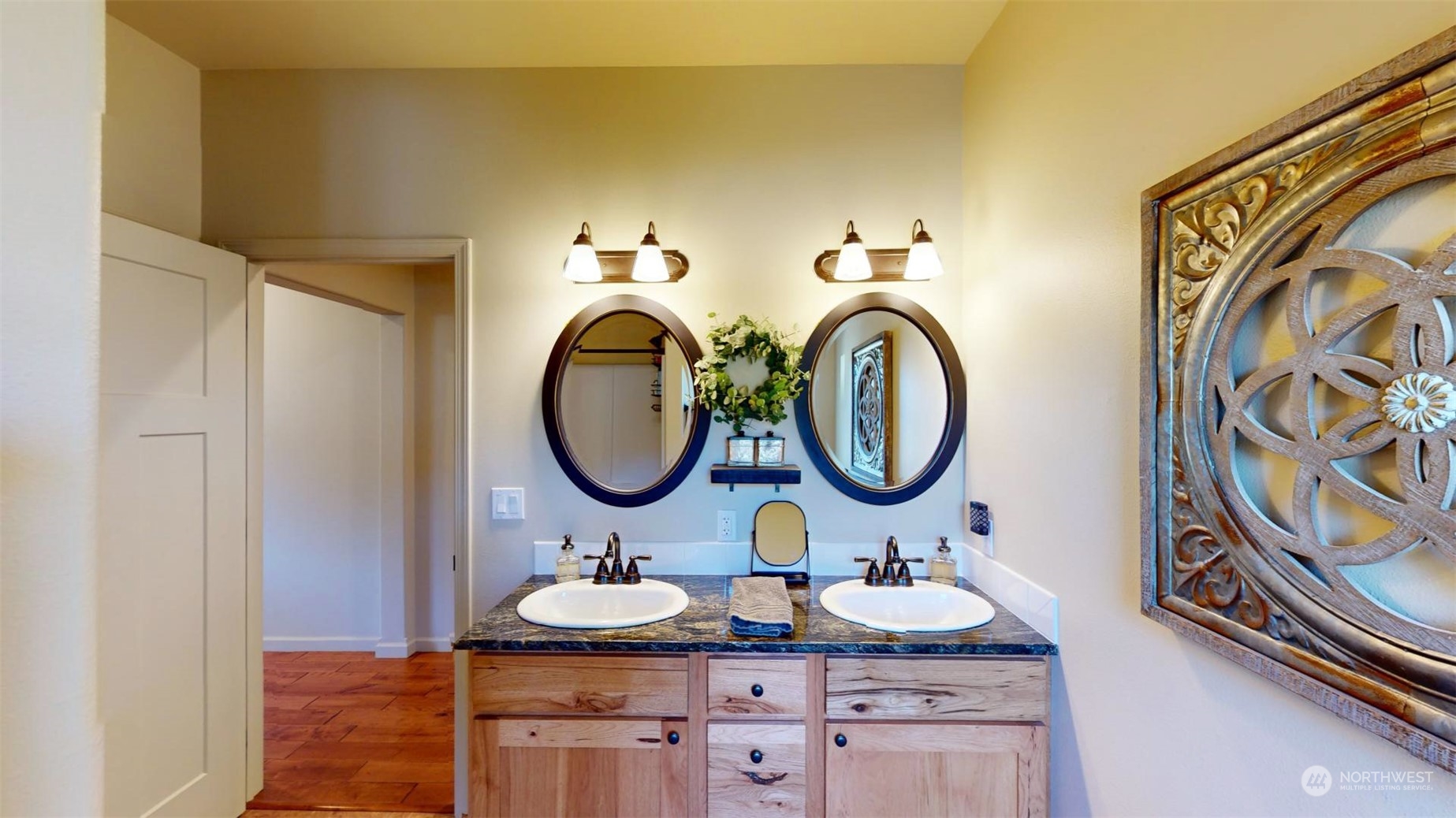 192 Hubbard Road Riverside, WA 98849 - Photo 22 of 40 a bathroom with a granite countertop double vanity sink and a mirror