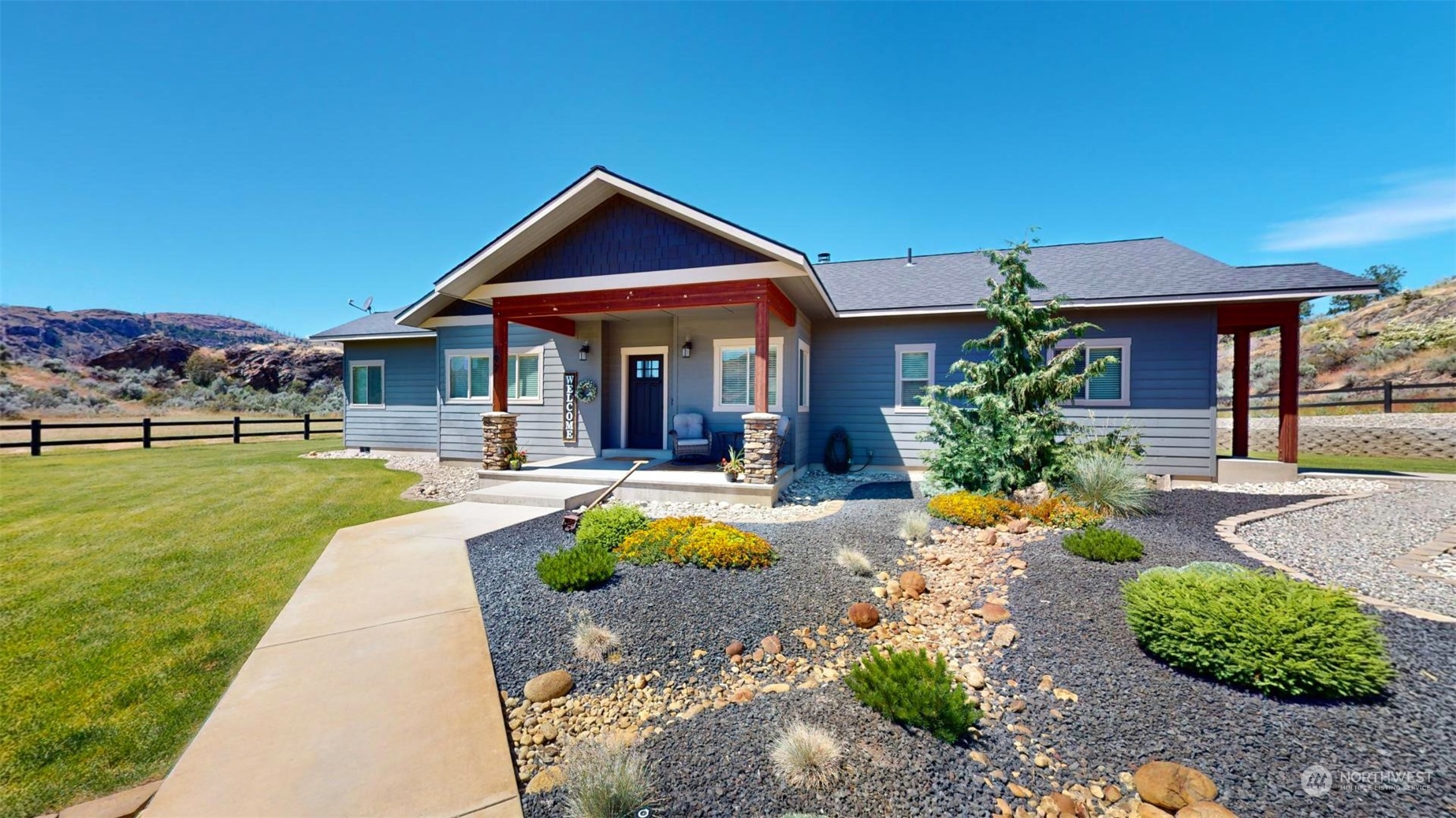192 Hubbard Road Riverside, WA 98849 - Photo 3 of 40 a front view of a house with a yard