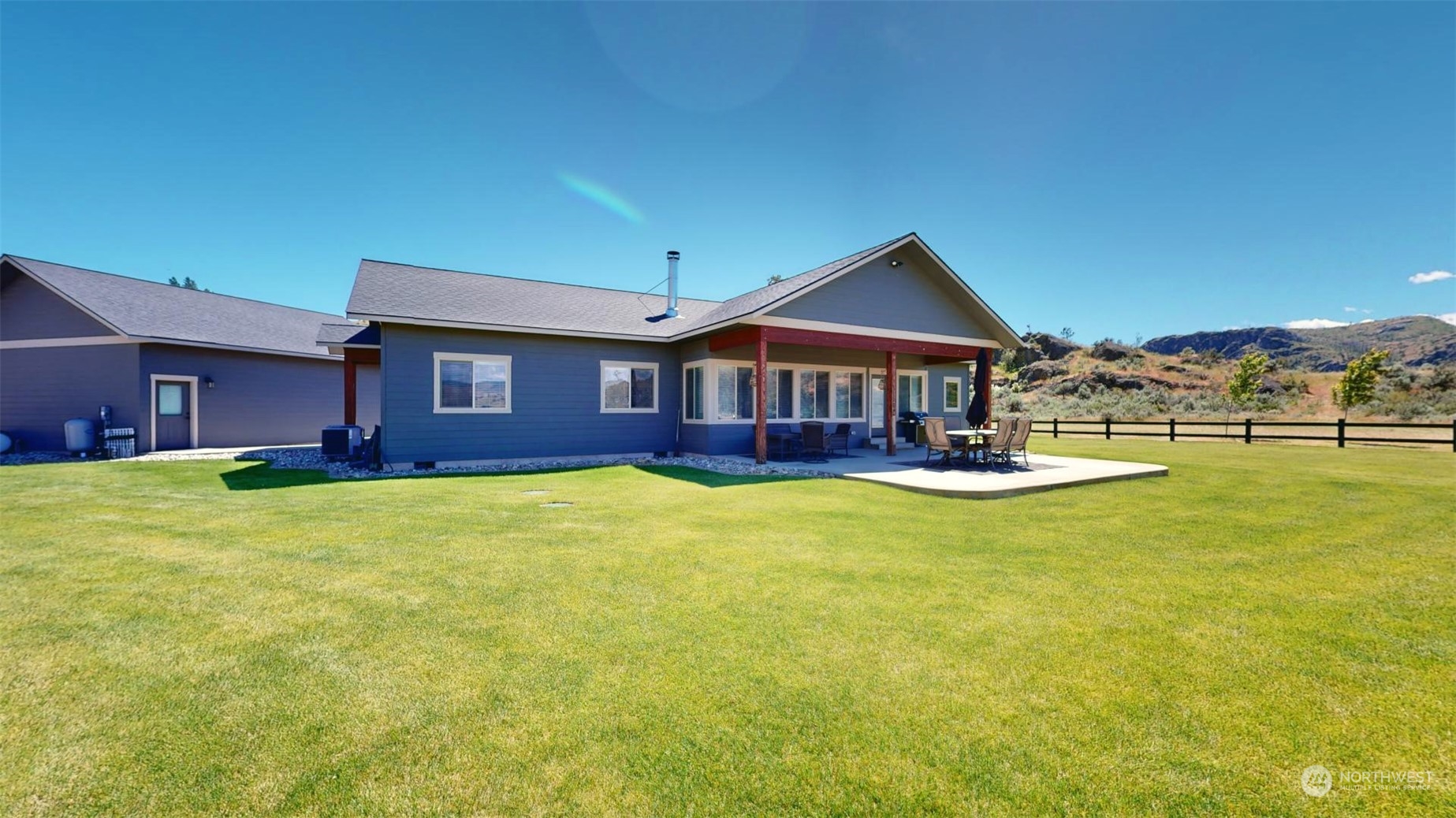 192 Hubbard Road Riverside, WA 98849 - Photo 4 of 40 a front view of a house with swimming pool having outdoor seating