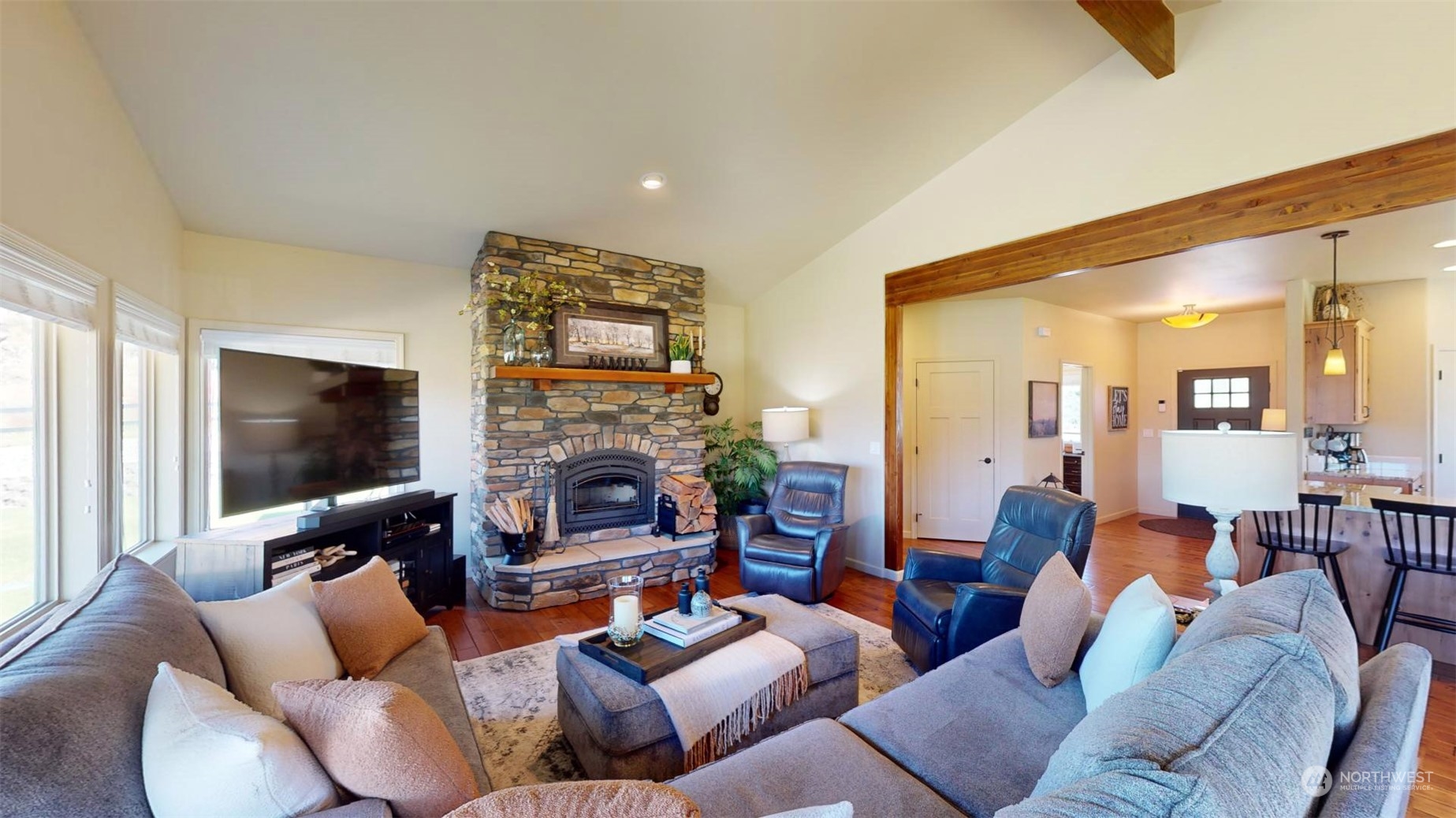 192 Hubbard Road Riverside, WA 98849 - Photo 8 of 40 a living room with furniture a fireplace and a flat screen tv