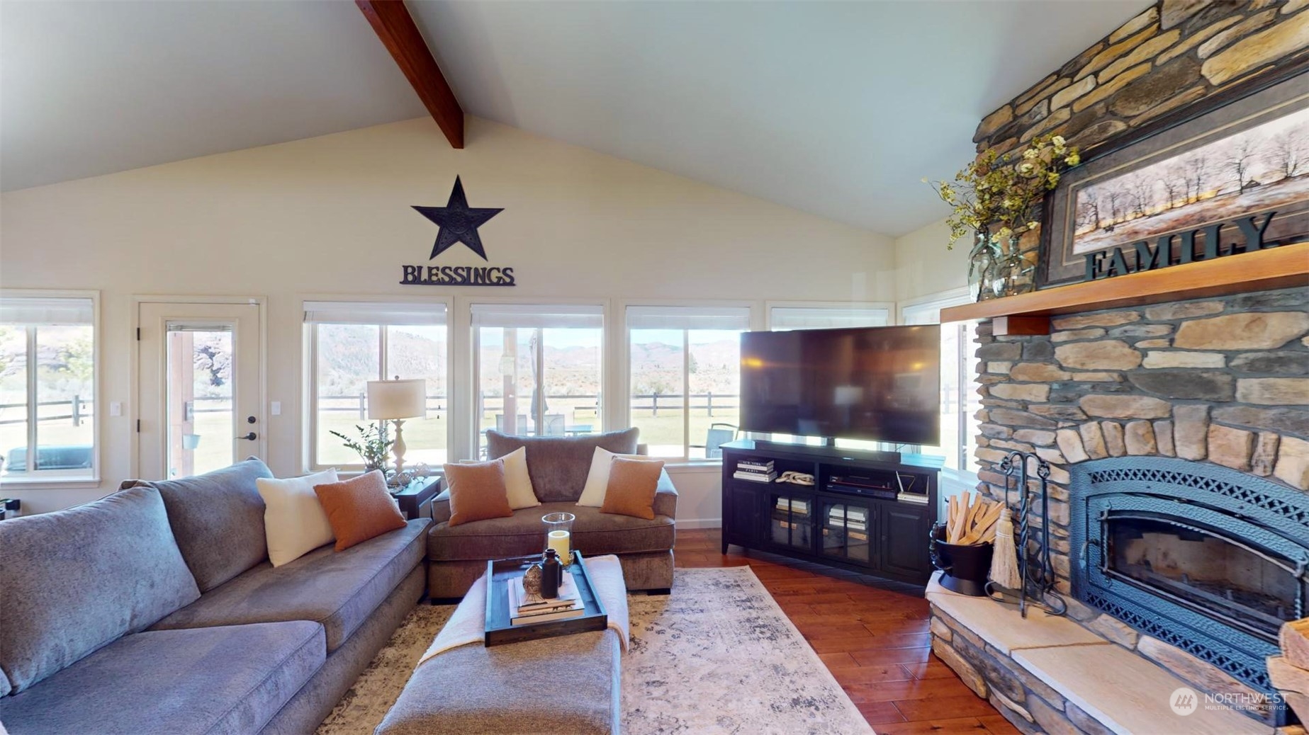 192 Hubbard Road Riverside, WA 98849 - Photo 9 of 40 a living room with fireplace furniture and a flat screen tv