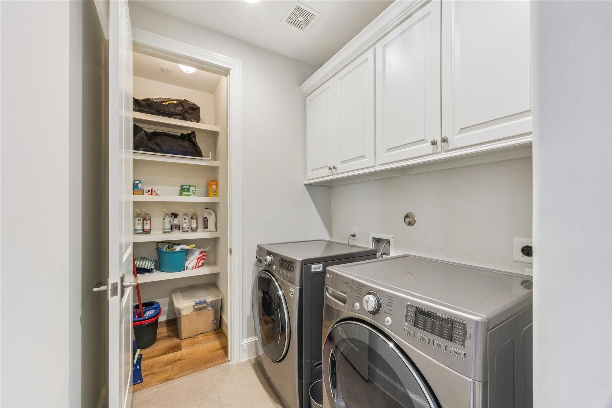 6331 Durford Street Houston, TX 77007 - Photo 26 of 37 Third floor utility room with ample space for full sized washer and dryer, storage cabinets and an added storage closet.