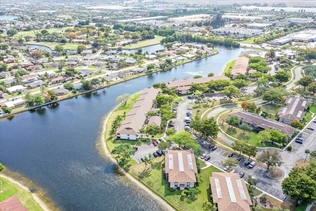 an aerial view of a house with a lake view