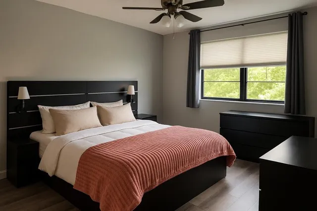 a bedroom with bed and window