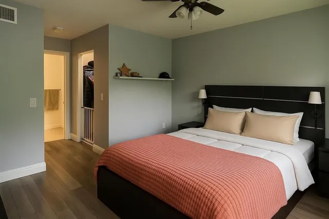 a bedroom with bed and window