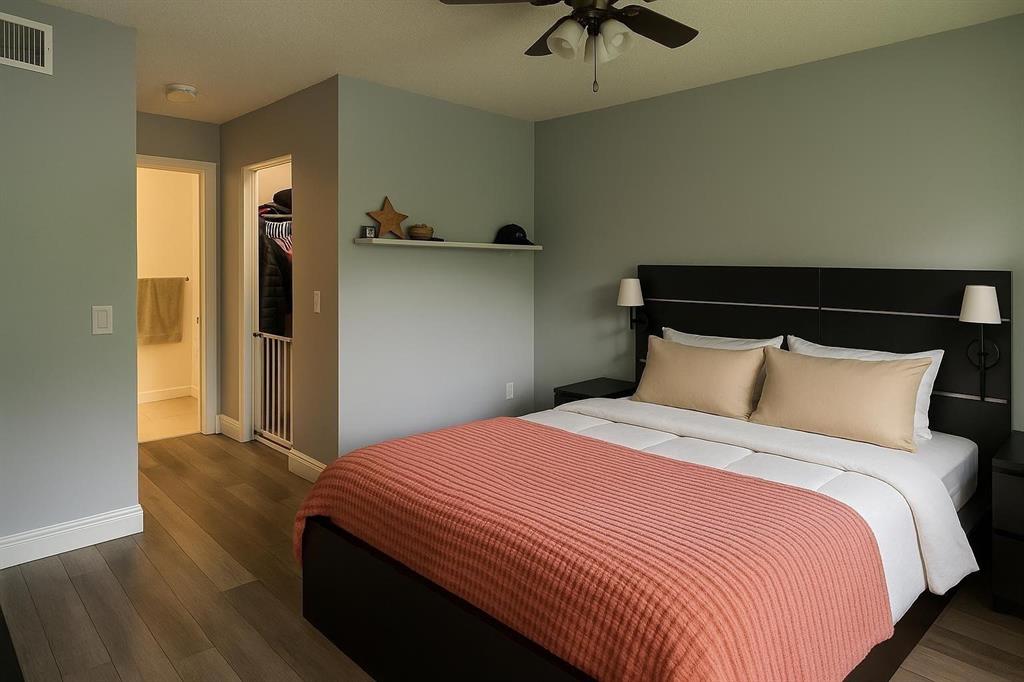 9682 West McNab Road, Unit 9682 Tamarac, FL 33321 - Photo 9 of 22 a bedroom with bed and window