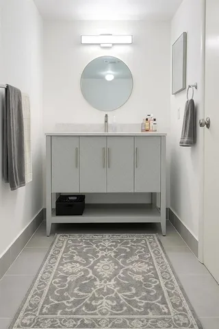 a bathroom with a sink a toilet and mirror