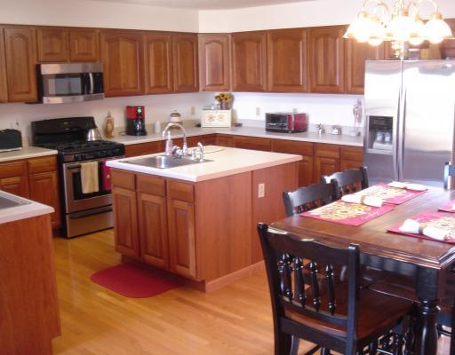 155 Riemer Road Sarver, PA 16055 - Photo 6 of 17 Kitchen. Oversized eat-in kitchen has upgraded oak cabinets & center island sink and 2nd sink along counter.