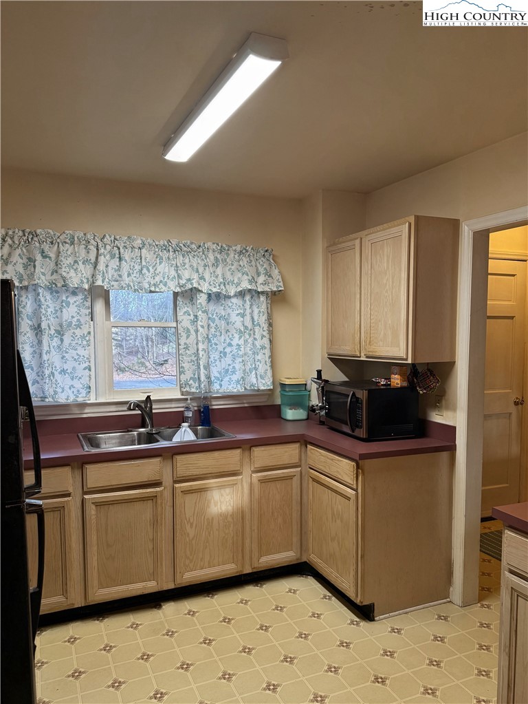 651 Rivers Edge Road Sparta, NC 28675 - Photo 12 of 36 a kitchen with stainless steel appliances a sink and cabinets