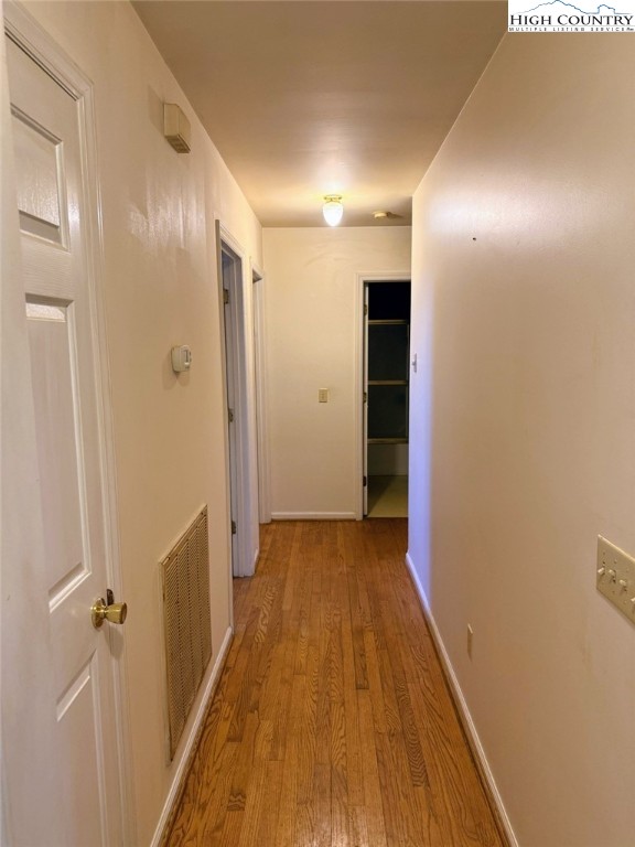 651 Rivers Edge Road Sparta, NC 28675 - Photo 14 of 36 a view of a hallway with wooden floor