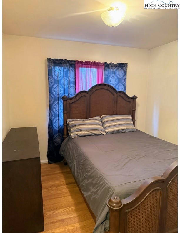 651 Rivers Edge Road Sparta, NC 28675 - Photo 16 of 36 a bedroom with a bed and window