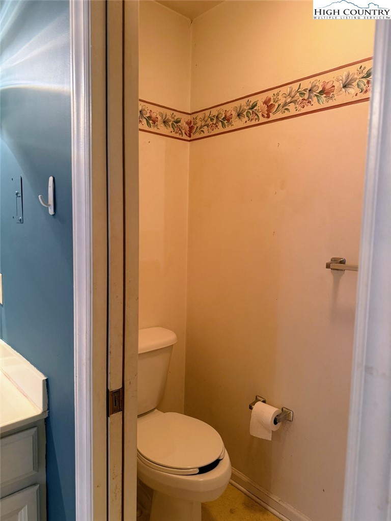 651 Rivers Edge Road Sparta, NC 28675 - Photo 21 of 36 a bathroom with a toilet and a shower