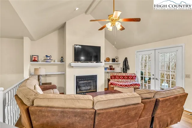 a bedroom with a bed and a mirror