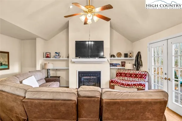 a kitchen with a stove and a chandelier