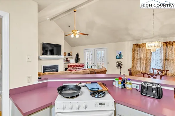 a kitchen with stainless steel appliances a sink and cabinets
