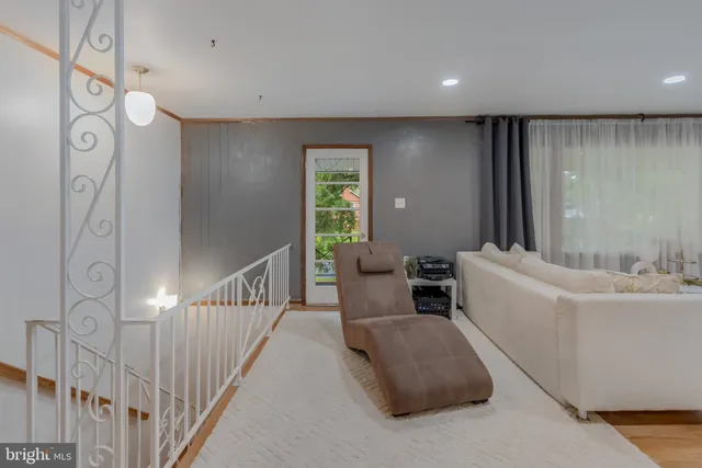 a bedroom with a bed and a flat screen television