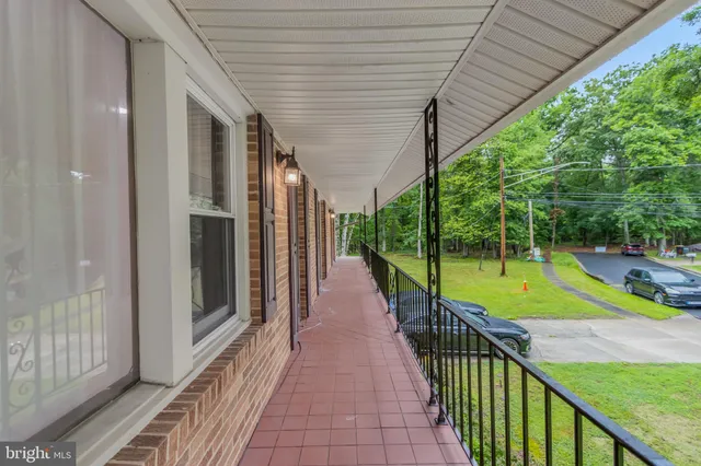 a bedroom with a bed a table and chair
