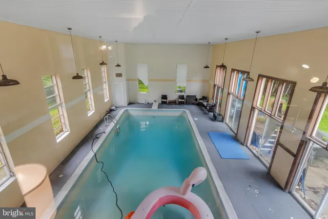 a view of a livingroom with bathroom and bathroom
