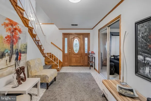 a living room with furniture pool table and a large window