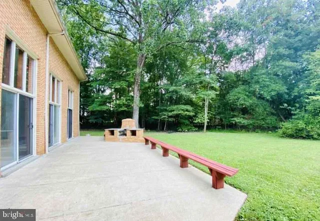 a view of a balcony with chair and front door