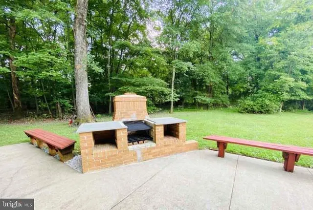 a view of a living room with a fireplace
