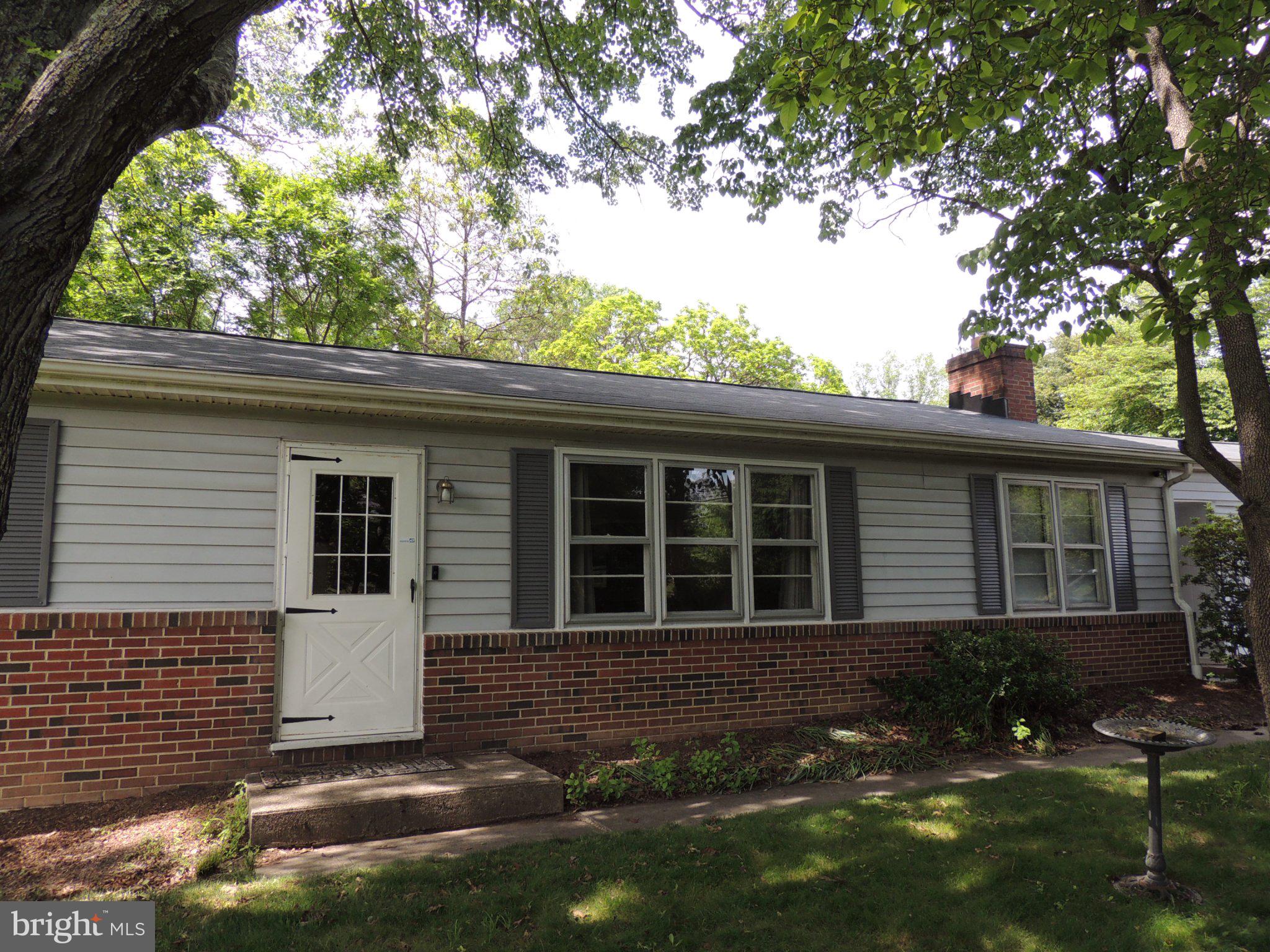 5838 Oklahoma Road Sykesville, MD 21784 - Photo 2 of 72 Charming home with lush greenery.