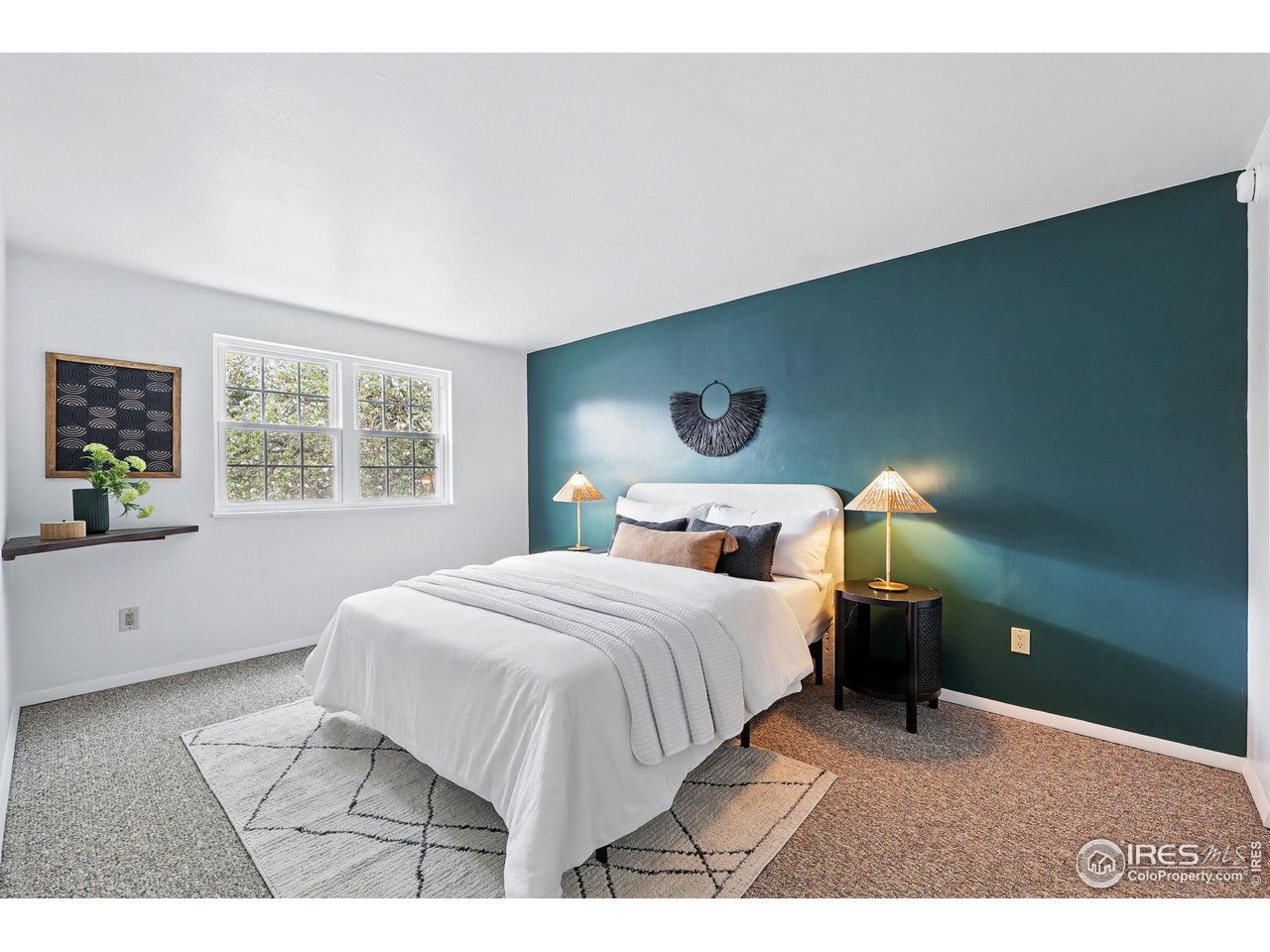 3390 34th Street, Unit B Boulder, CO 80301 - Photo 16 of 31 a bedroom with a bed and a window