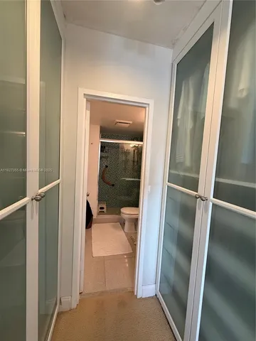 a bathroom with a tub and mirror