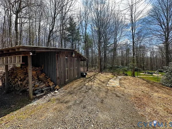 a view of a backyard of the house