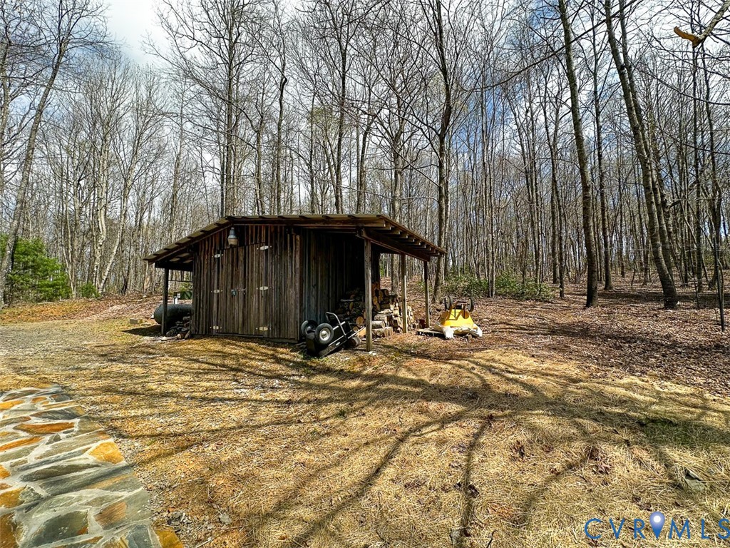 311 Dan River Road Meadows Of Dan, VA 24120 - Photo 13 of 50 a view of a house with trees and sitting area