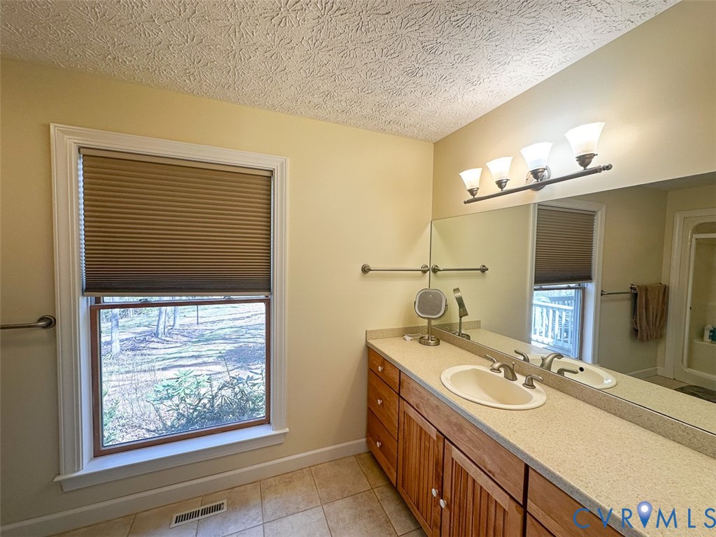 311 Dan River Road Meadows Of Dan, VA 24120 - Photo 25 of 50 a bathroom with a sink and a mirror