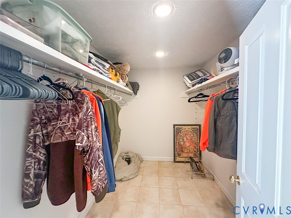 311 Dan River Road Meadows Of Dan, VA 24120 - Photo 27 of 50 a view of walk in closet with clothes and shoes