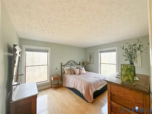 a bedroom with a bed and a couch