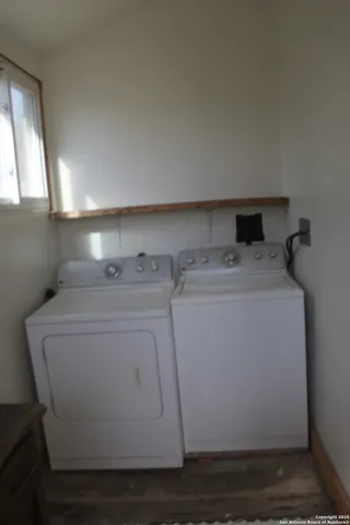 a view of a dining room with furniture and window