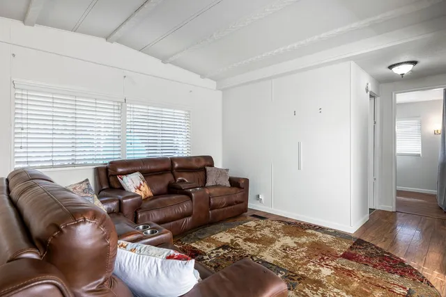 a living room with furniture and a rug