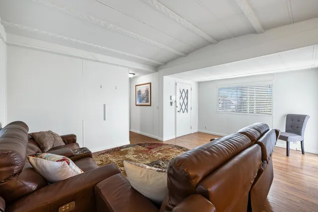 a view of kitchen with wooden floor and window