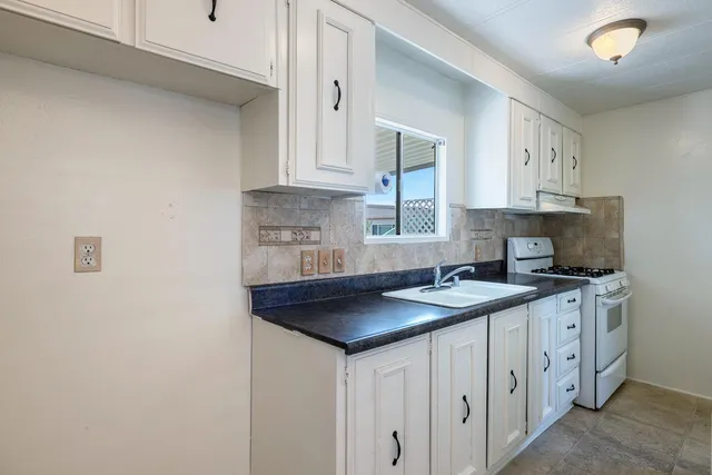 a bathroom with a sink double vanity and a mirror