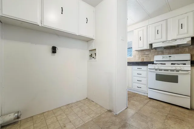 a room with a bed and a television