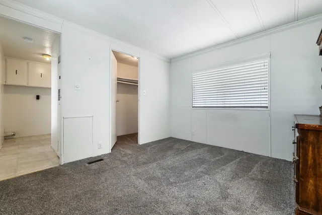 a room with a dresser and a mirror