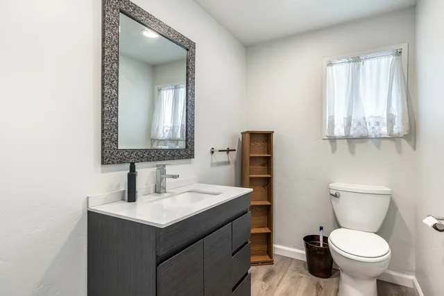 a view of a room with wooden floor and closet