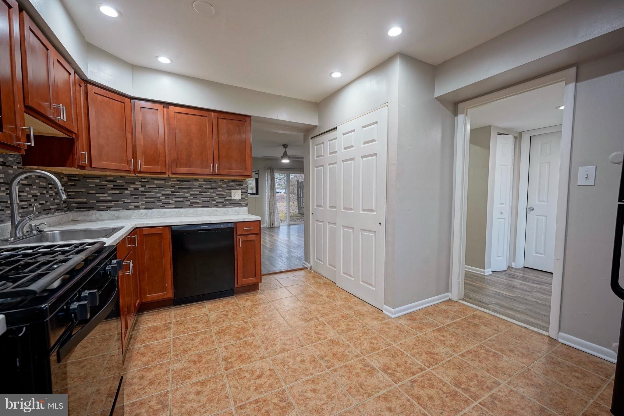 151 Echelon Road Voorhees, NJ 08043 - Photo 18 of 40 a kitchen with stainless steel appliances granite countertop a stove a sink and a refrigerator