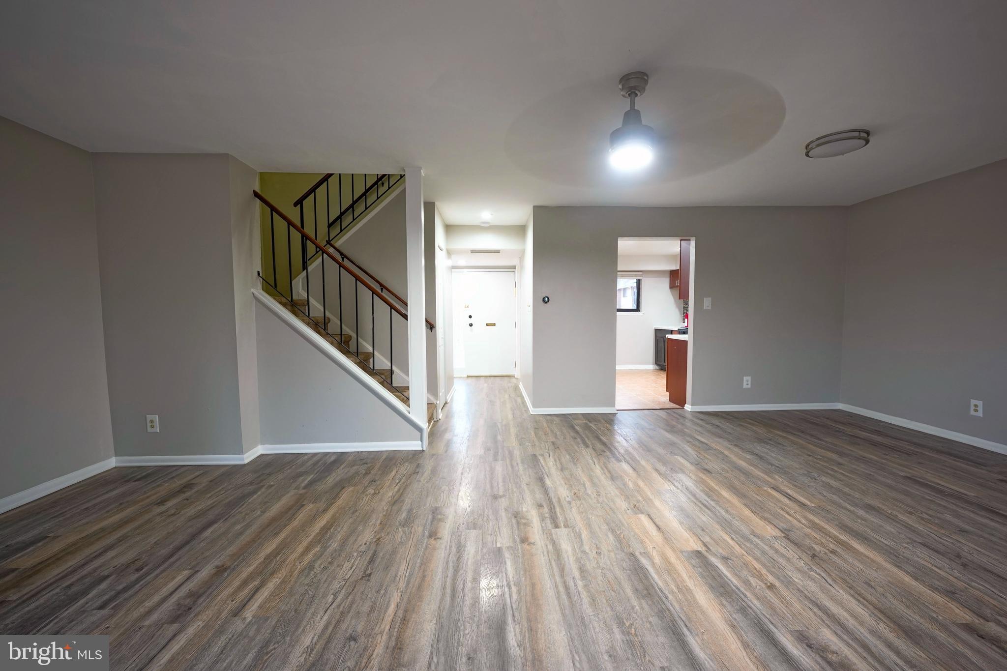 151 Echelon Road Voorhees, NJ 08043 - Photo 19 of 40 a view of an empty room with wooden floor and stairs