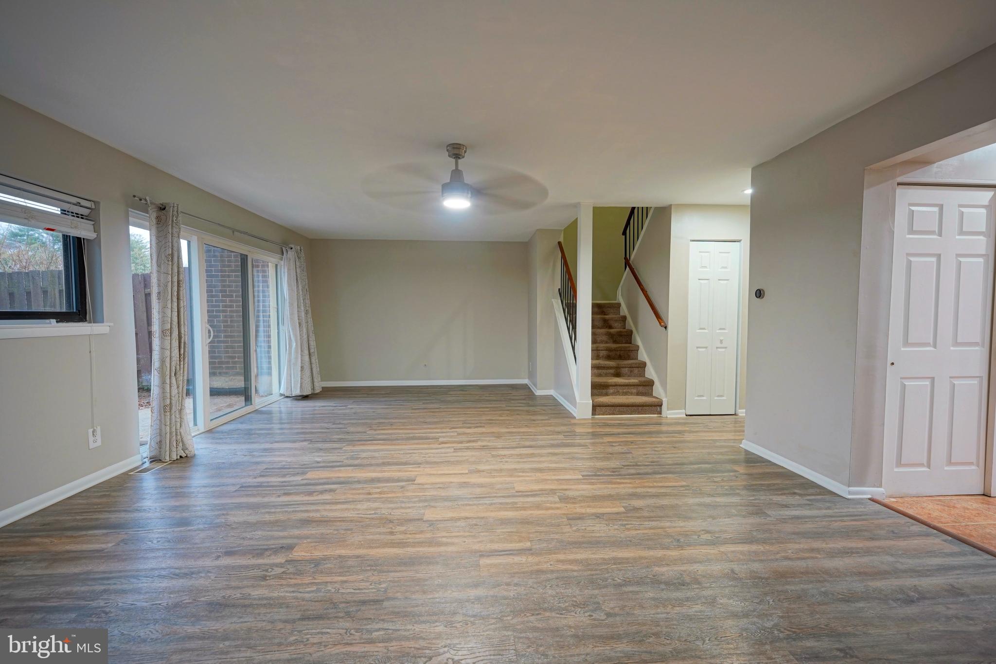 151 Echelon Road Voorhees, NJ 08043 - Photo 21 of 40 a view of an empty room with wooden floor and stairs