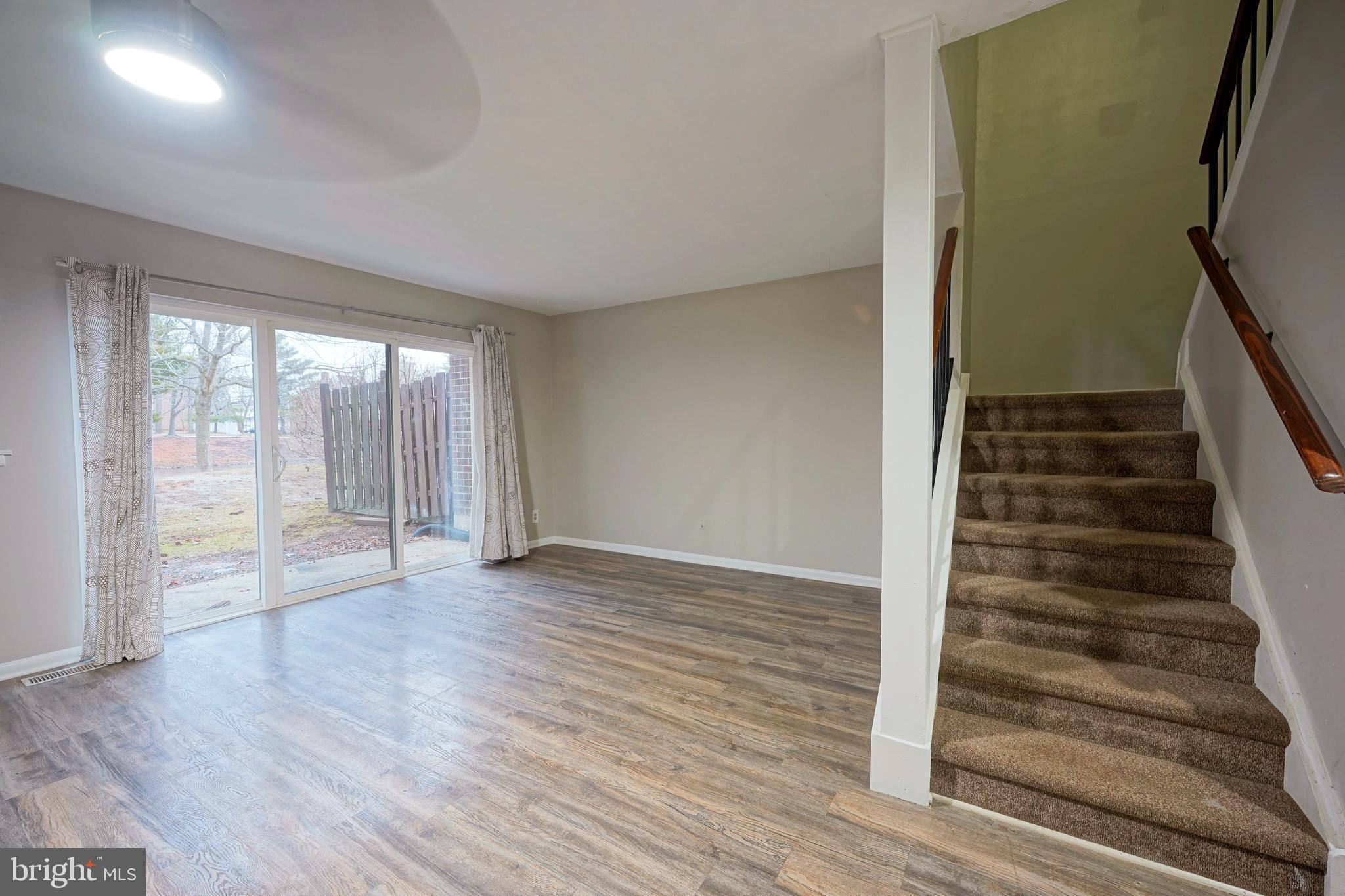 151 Echelon Road Voorhees, NJ 08043 - Photo 23 of 40 a view of an empty room with wooden floor and windows