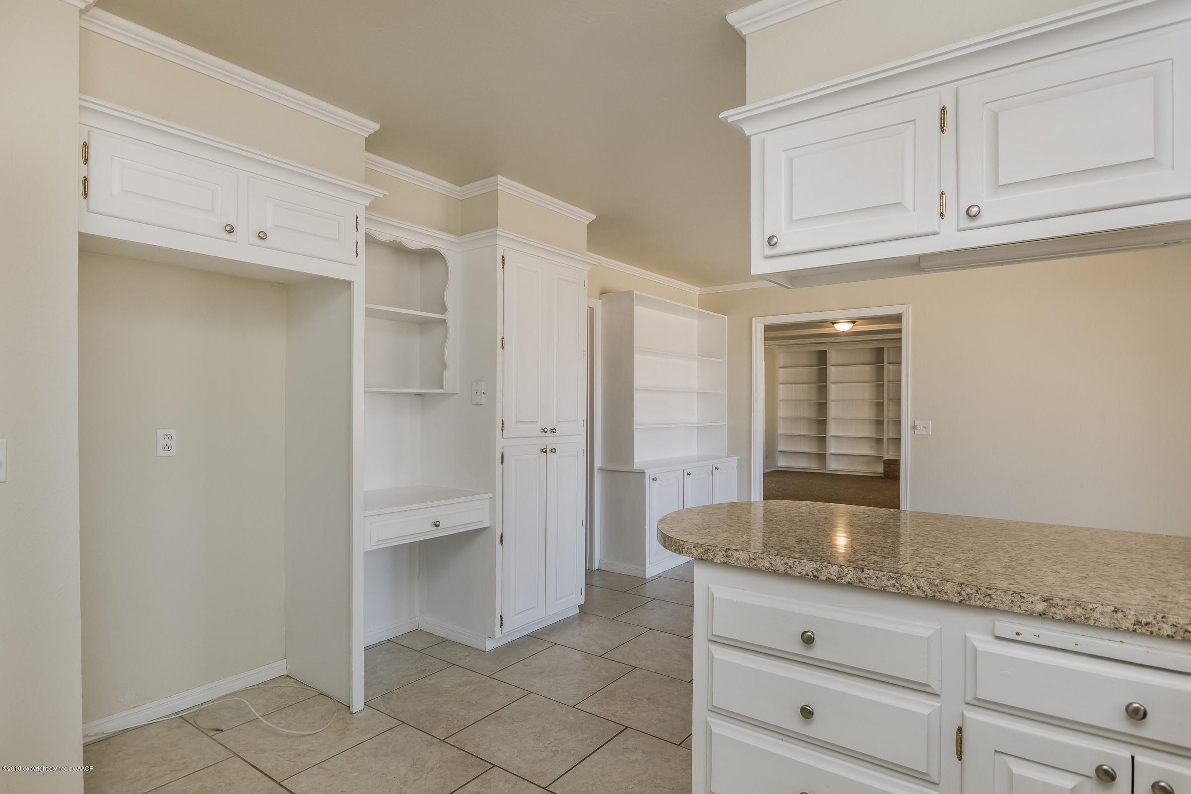 3312 Lombard Road Amarillo, TX 79106 - Photo 11 of 23 a bathroom with a granite countertop sink and a mirror
