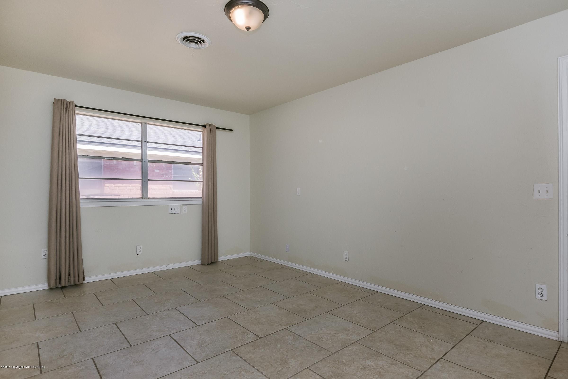 3312 Lombard Road Amarillo, TX 79106 - Photo 12 of 23 an empty room with windows