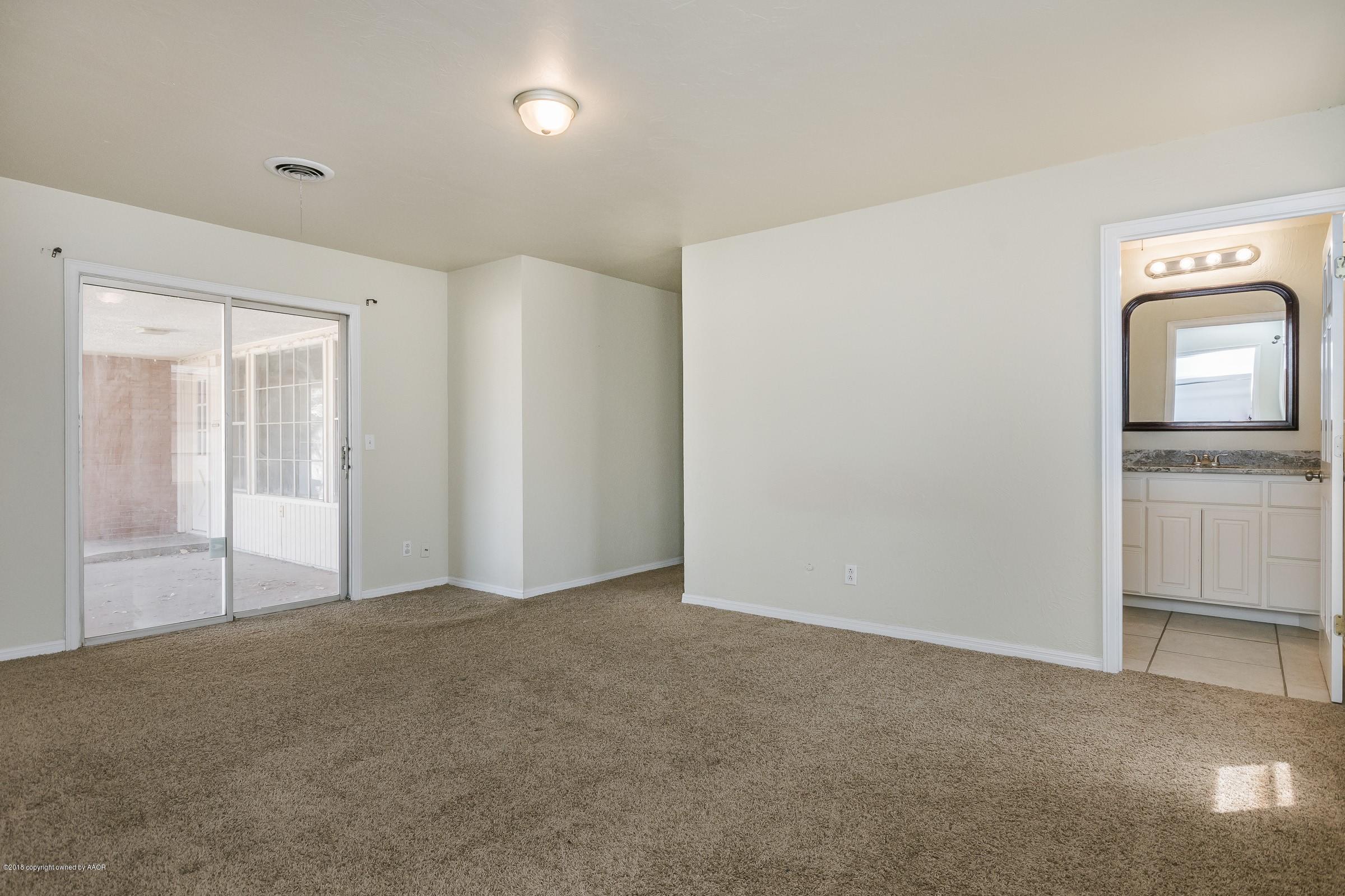 3312 Lombard Road Amarillo, TX 79106 - Photo 15 of 23 a view of an empty room with closet and wooden floor